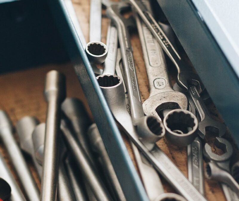 a bunch of wrenches and other tools in a box